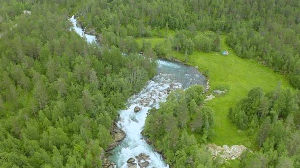 Gudbrandsjuvet Rushing Through Deep Ravine With Lush Green Trees In Andalsnes, Norway. aerial