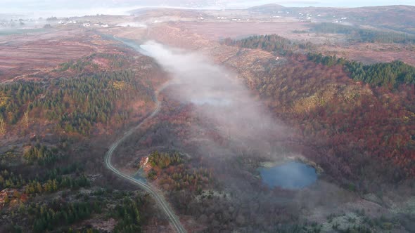 Aerial View of Bonny Glen in County Donegal with Fog  Ireland