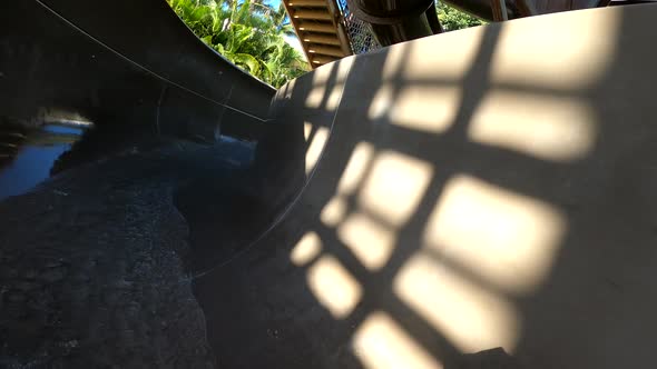 Waterslide summer vacation fun. POV action shot.