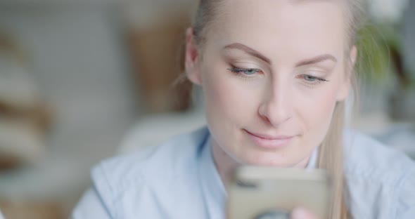 Beutiful Woman Using Smartphone and Smile