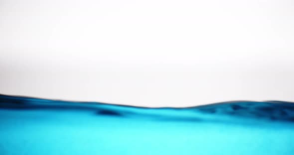 Blue Water Surface In Motion Against White Background