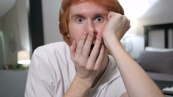 Wondering, Shocked Casually Sitting Redhead Man