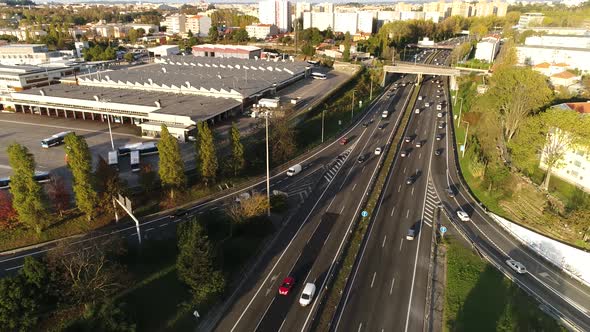 Aerial view of a freeway intersection. Clip. Highway and overpass with cars and trucks, interchange