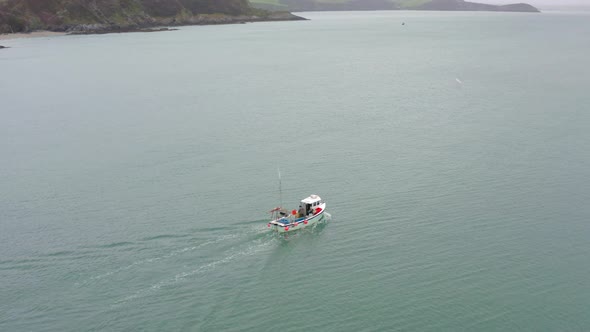 Fishing Boat Heading Out to Sea in Cornwall UK