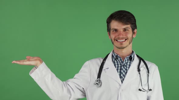 Male Doctor Smiling Holding Copy Space on His Hand