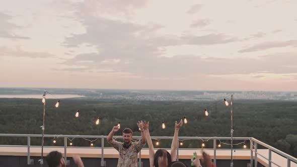 Group of People Partying on Rooftop Terrance