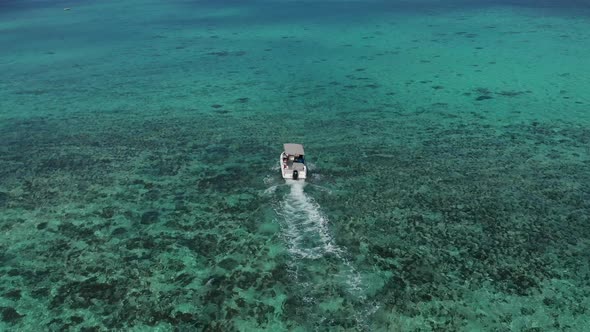 Aerial Drone Tracking Video of Luxury Yacht Cruising in Deep Blue Open Ocean Sea