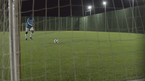 Man Scoring Goal on Soccer Training