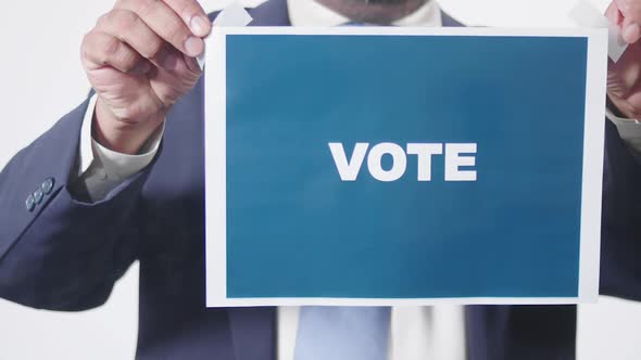 Businessman Posts Sign On Window Vote