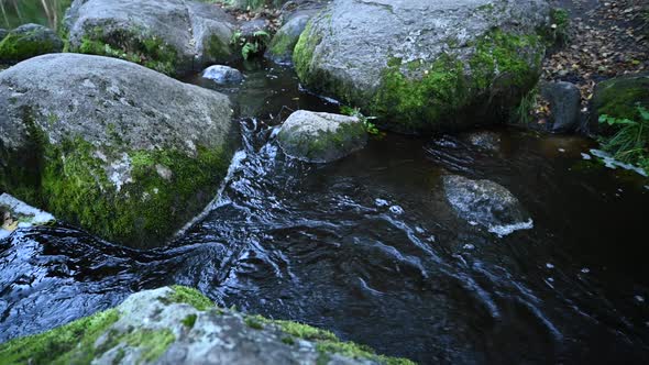 A Wild Mountain River Flowing Through Rocks. Close-up of River Rocks