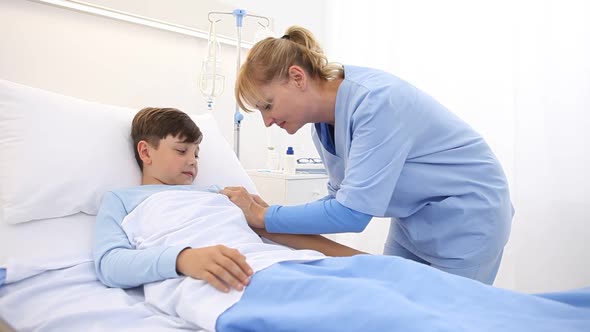 Child lying in the hospital bed terrified and frightened by the syringe needle