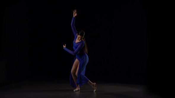 Slow Motion of a Glorious Ballerina Dancing Elements of Ballet