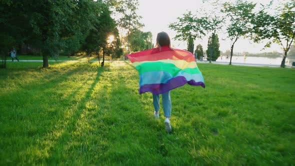 Woman Holding Rainbow Flag, Showing Tolerance.