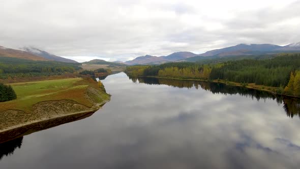 Aerial view of Laggan dam artificial lake and beautiful countryside and wood