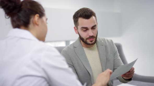 Female Medical Specialist Consulting Patient