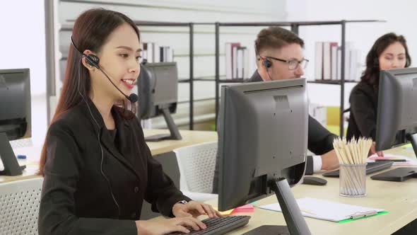 Business People Wearing Headset Working in Office