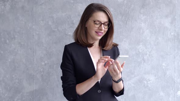 Businesswoman Using Mobile Phone, Writing Email or Text Message