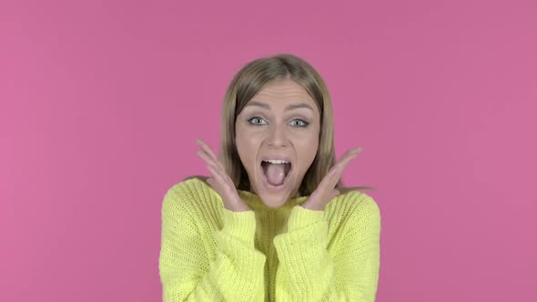 Excited Young Girl Screaming Pink Background