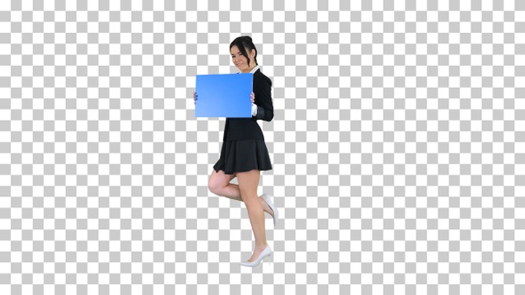 Cute girl holding empty board announcing or presenting something