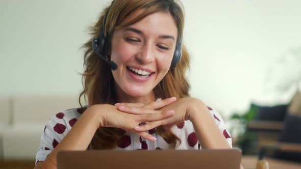 Woman Wear Headset Communicating By Conference Call Speak at Home Office