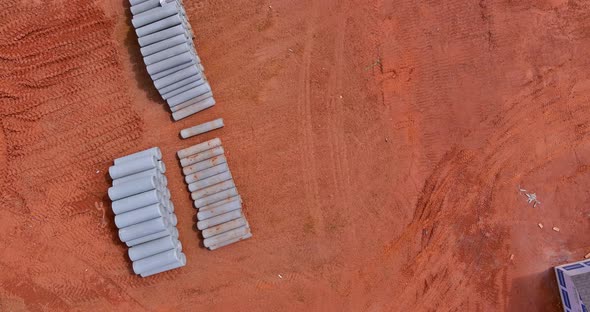 Aerial View Under Construction Site Concrete Pipes Stacking for a New Home