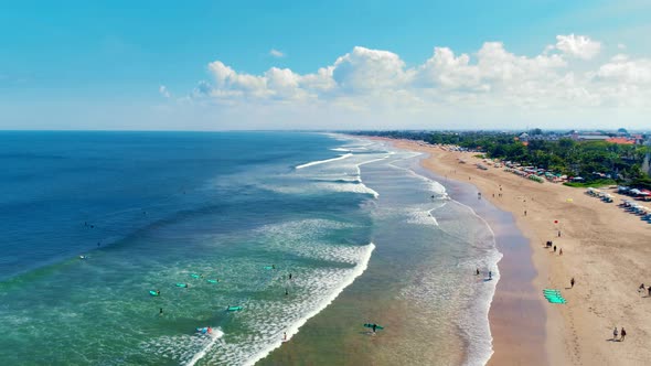 Aerial View Of The Ocean, Beach And Surfers