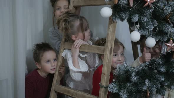 A group of children with New Year's gifts, happy friends for Christmas