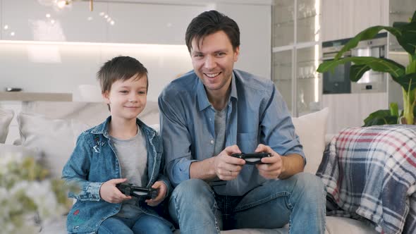 Father and Son Playing Video Game