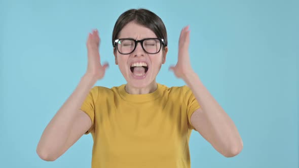 Angry Young Woman Shouting and Screaming on Purple Background