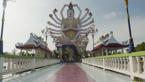 Zoom shot of the Wat Plai Laem temple in Koh Samui with the multiple arms statue