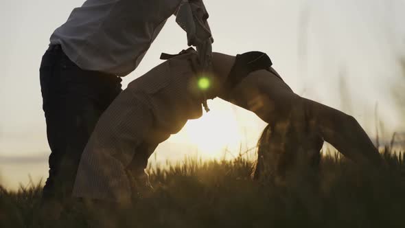 Slow motion shot of couple dancing outdoors in the evening