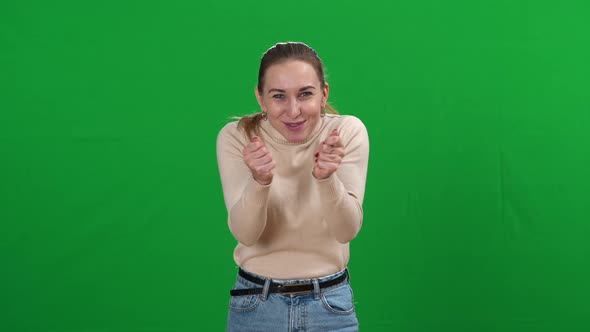 Happy Young Beautiful Slim Woman Expressing Positive Feelings at Chromakey Background