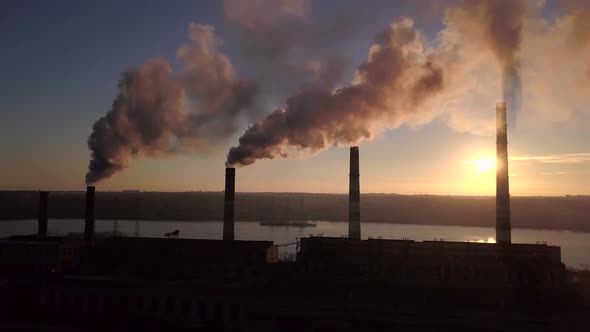 Smoke From Factory Chimneys on Background of Sunset Sky 005