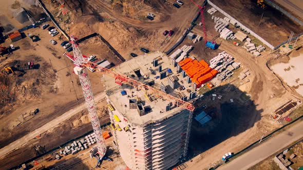 Aerial Flight Over New Constructions Development Site with High Tower Cranes