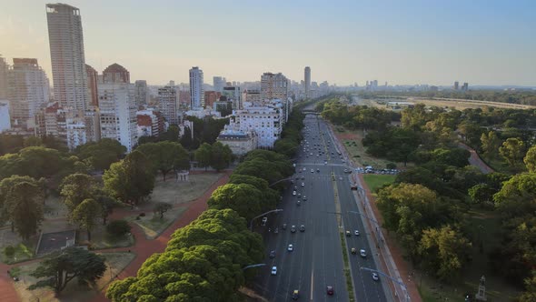 Dense urban Palermo Libertador Avenue traffic Buenos Aires urban high rise skyline aerial dolly left