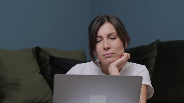 Young Woman That Is Working at the Computer Receiving a Gift From Her Husband