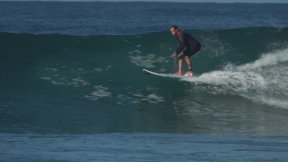 Paddle Boarder Surfing Large Wave