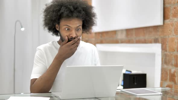 Shocked African Man Wondering in Awe Astonished