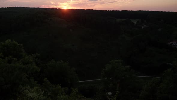 Bird's Eye Panoramic Shooting of Mountain Valley Landscape with Rocks and Thick Wood in Evening