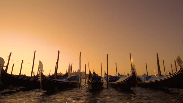 Beautiful Sunny Day Blue Sky in Venice, Italy, with Gondolas in the Canals