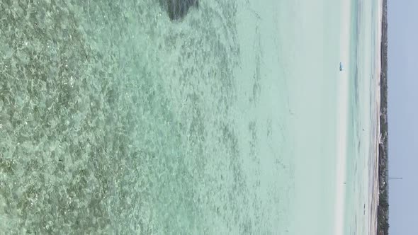 Vertical Video Boats in the Ocean Near the Coast of Zanzibar Tanzania Aerial View