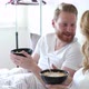 Happy Married Couple Being Romantic in Bed Sharing Cereal - VideoHive Item for Sale