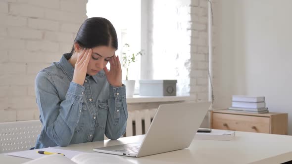 Young Girl with Headache Working on Laptop