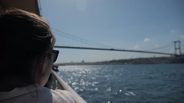 Woman Enjoys Seascape Traveling By Boat in Shimmering Sea