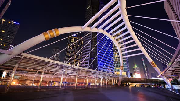 4k Time-lapse of People walking at Chong Nonsi skywalk at night, Bangkok, Thailand