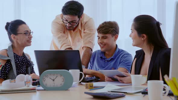 Group Meeting of Creative Business People Designer and Artist at Office Desk