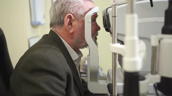 Examination of the Elderly Man on the Corneo Topographer