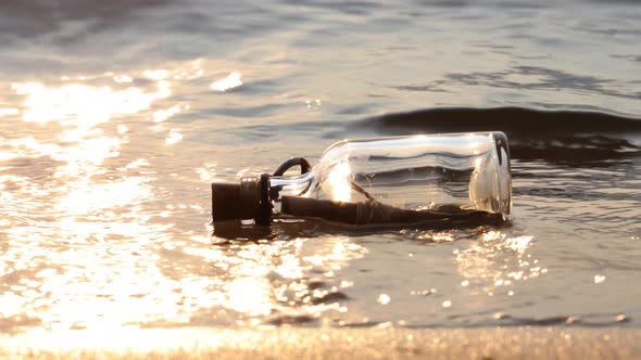 Message in the Bottle Against the Sun Setting Down