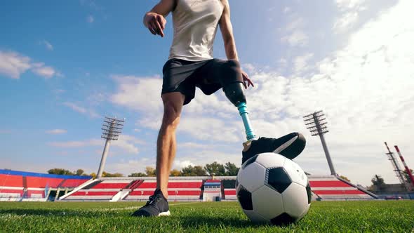 Paralympic Football Player Is Dribbling the Ball