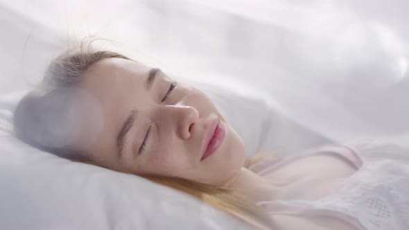 Happy Woman Waking Up on Serene Morning and Smiling for Camera